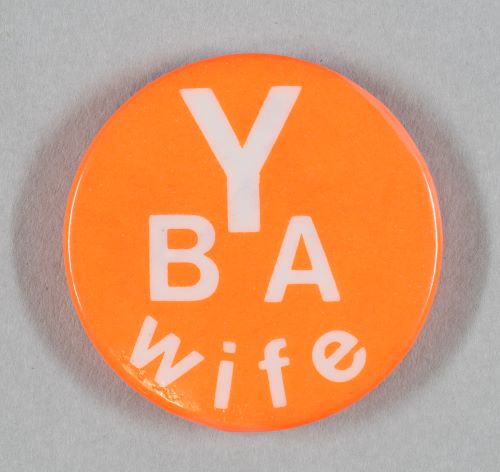 Button badge with text 'Y B A Wife'